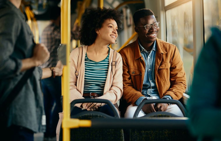Two riders talking on board a Pierce Transit bus