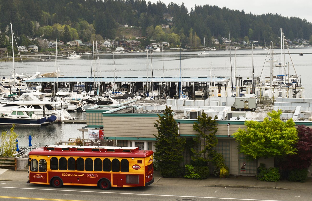 Pierce Transit trolley passing the Gig Harbor marina